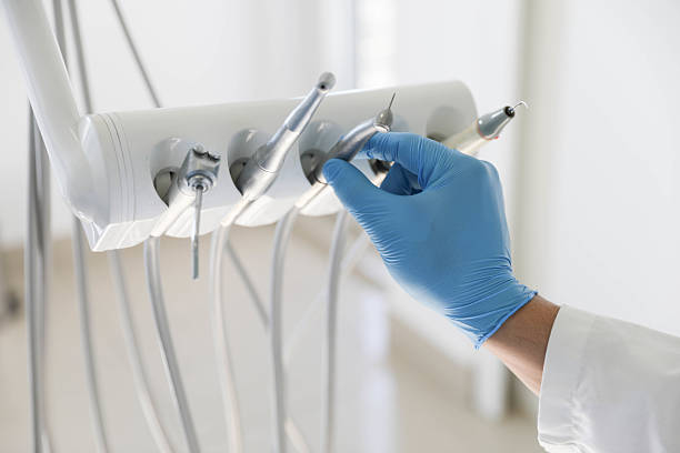 Professional Tooth Extraction technician working in La Cygne, KS